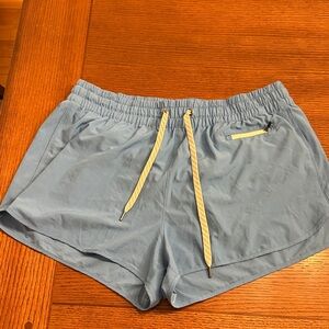 Vuori Women's Athletic Shorts in Blue with Yellow Accents